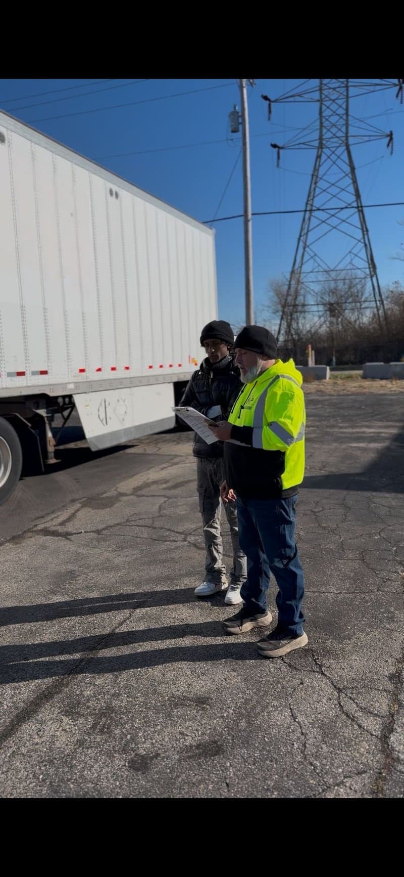 Instructor reviewing pre-trip inspection checklist with student